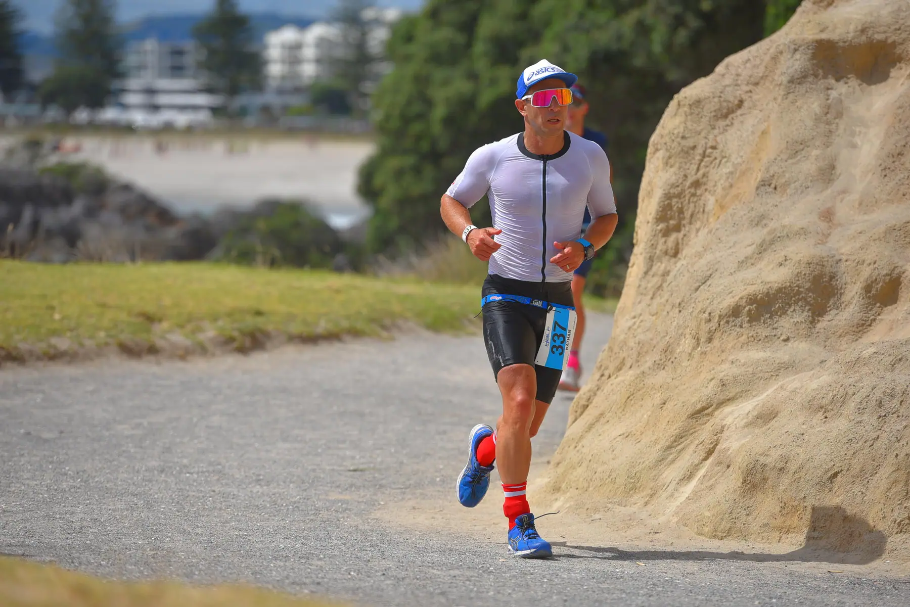 Nathan running the closing leg of an Ironman 70.3 race